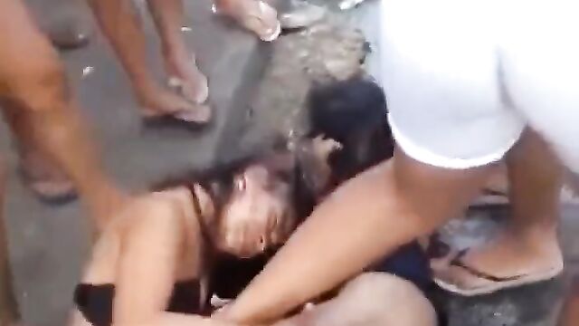 Pussy and boobs exposed as sluts fight inside gutter in public