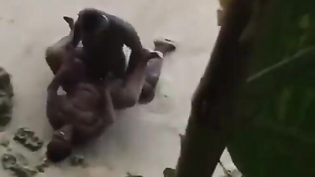 Naked randy couple caught having sex on the beach in public - 1 image