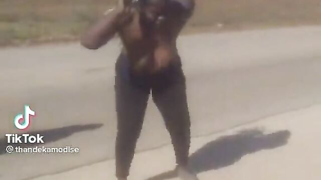 African women dancing with naked breasts