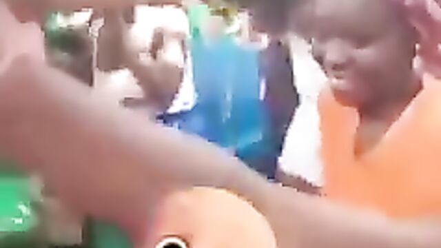 African sluts showing their naked breasts in public at a party in broad daylight - 1 image