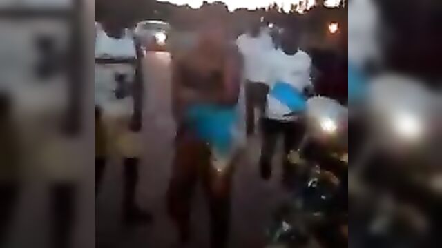 Big breasts exposed as Two girls strip naked to fight in public - 1 image