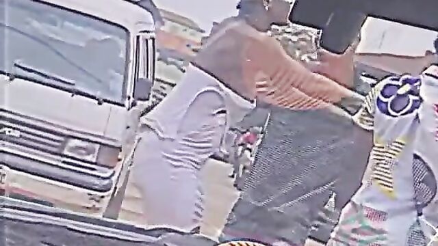 Boobs out in crazy public street fight - 1 image