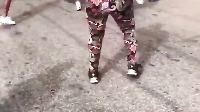 Breasts pop out as 2 women fight in public on the street - 3 image