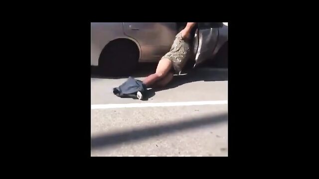Dude holds on to wife’s car as she leaves him after she caught him cheating