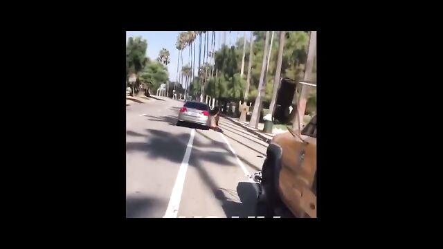 Dude holds on to wife’s car as she leaves him after she caught him cheating - 4 image