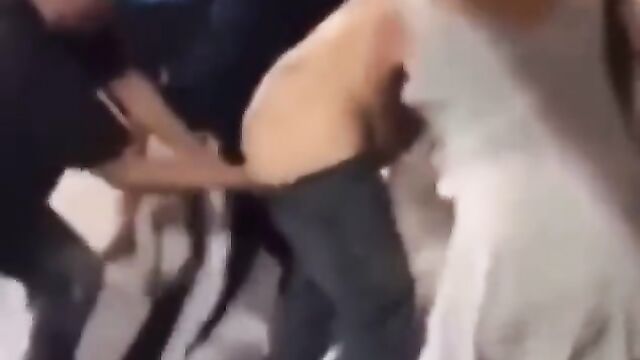 Man gets punched in the ass while fighting in public