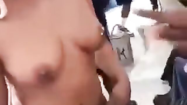 Woman puts money in girl’s pussy, as she shows breasts in public at a Lagos party - 4 image